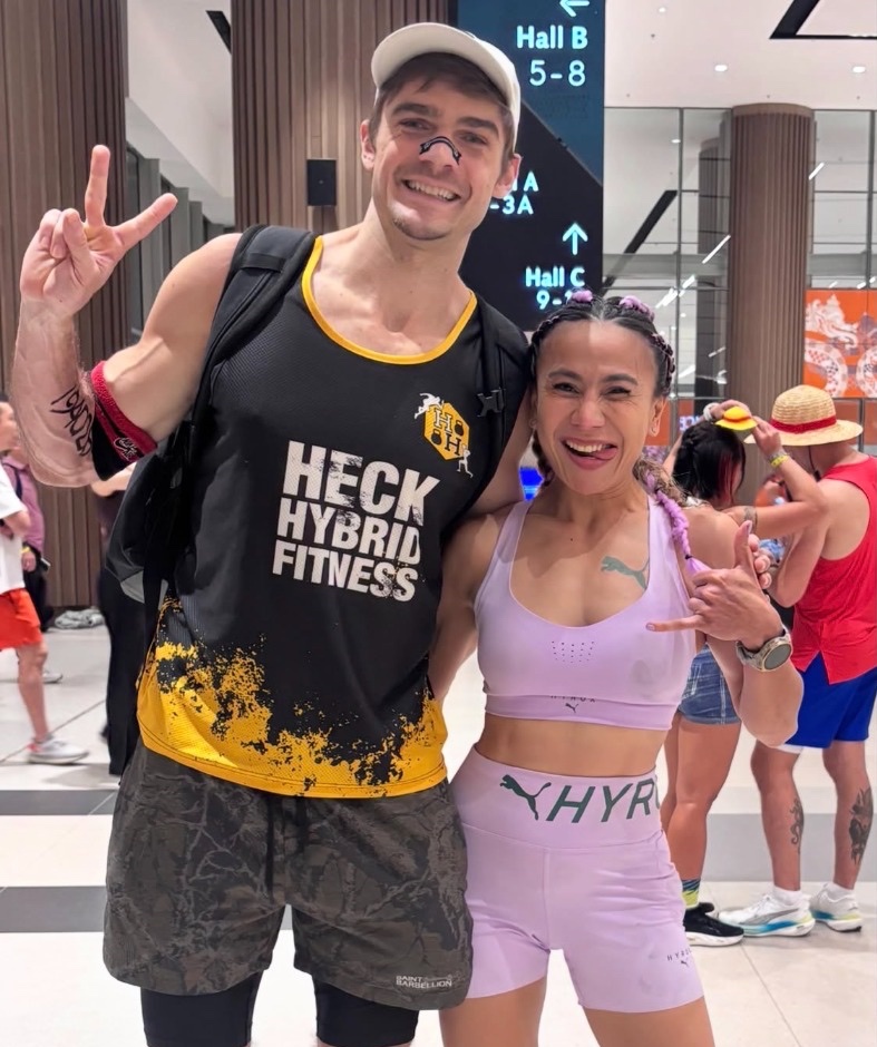 Two Roxjaya athletes racing side by side at Hyrox