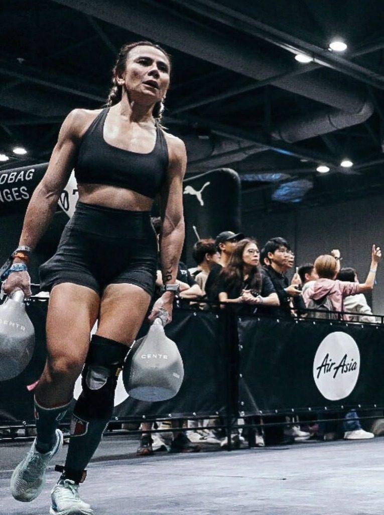 Dina on the kettlebell farmers carry